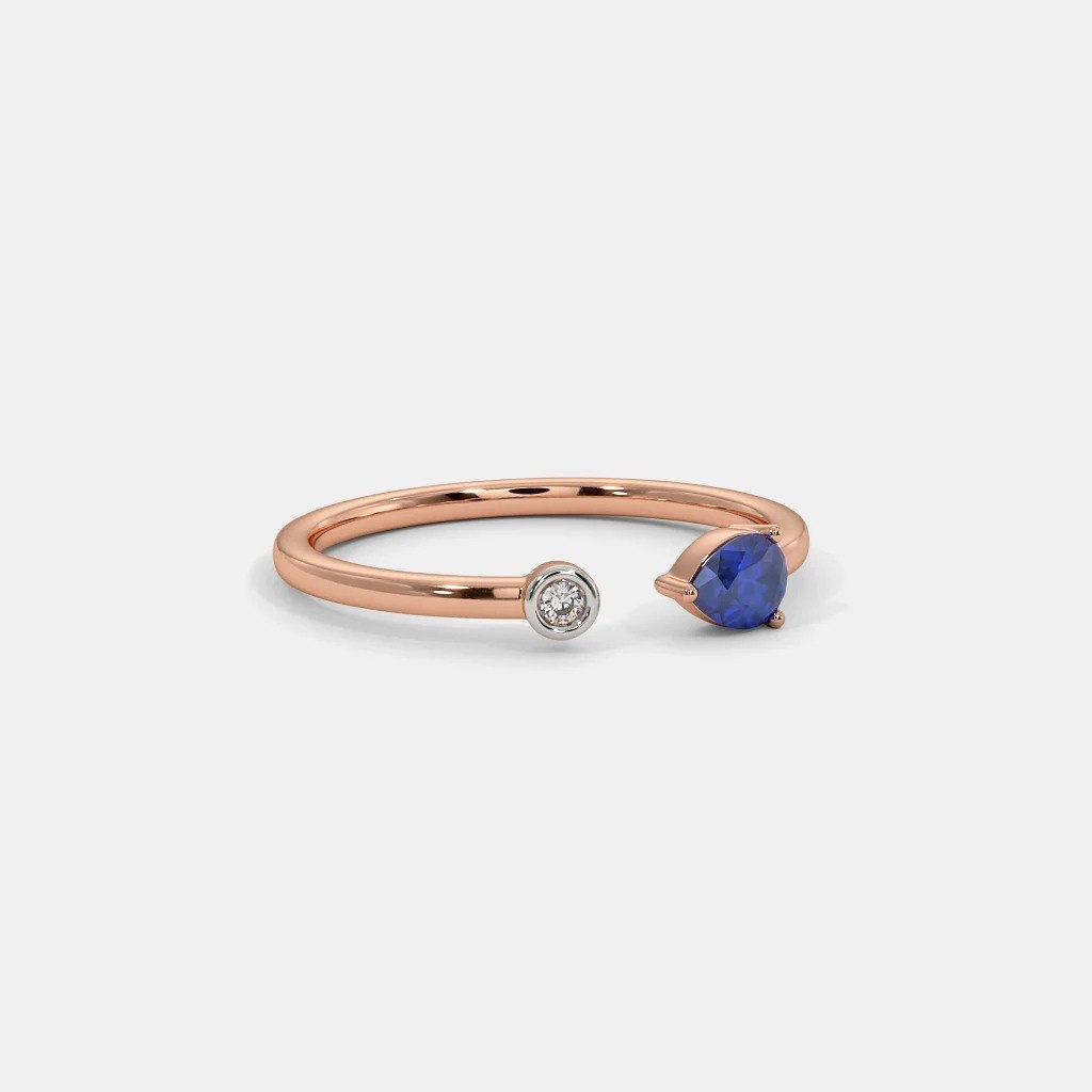 18k Rose Gold Ring with Pear-Cut Tanzanite and Round-Cut Diamond